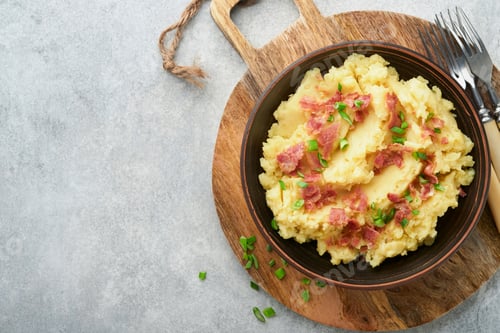 Preview: Mashed boiled potatoes. Bacon mashed potatoes with green onion, pepper and cheddar cheese in bowl on