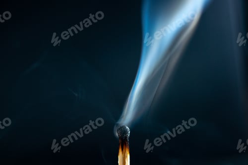 Preview: Front view of wooden burnt one match extinct on the right side on dark background
