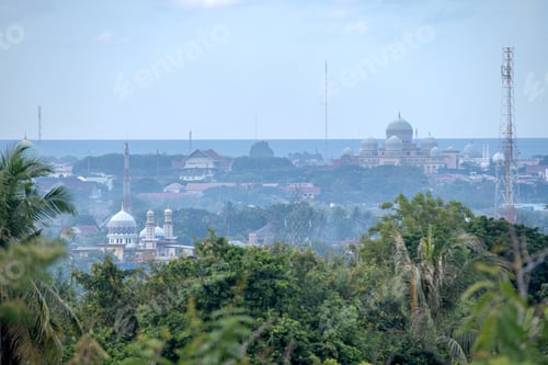 Preview: The Dome of a Mosque Surrounded by Lush Greenery in Indonesia