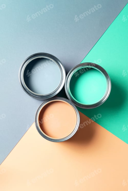 Preview: Open cans of paint on bright multicolored background. Top view. Copy space. Trendy green color