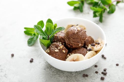 Preview: Chocolate and banana fruit ice cream with almond nuts served in bowls