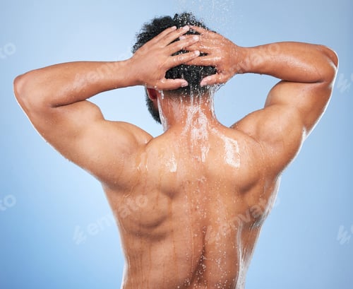 Preview: Man, shower back and wash in studio with water, splash or hygiene with self care by blue background
