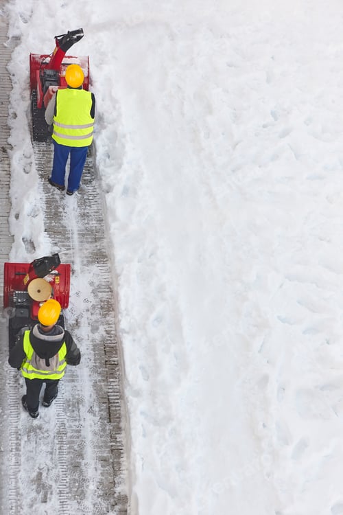 Preview: Workers Clearing Snowy Sidewalk with Snow Removal Equipment