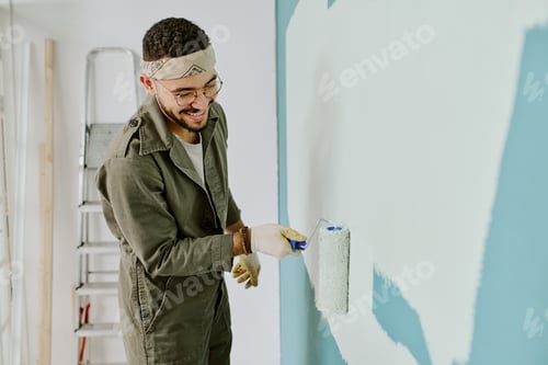 Preview: Young Adult Man Painting Wall during Home Renovation Project