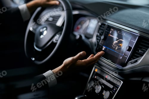 Preview: Close up of man examining multimedia system of luxury car