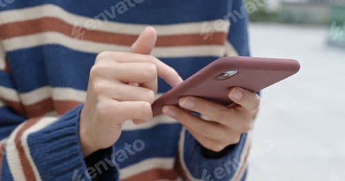 Preview: Close up of woman use of mobile phone