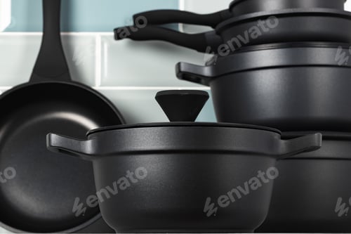 Preview: Set of black cookware on kitchen counter