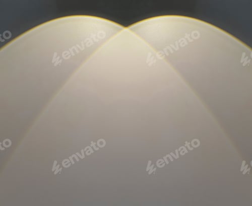 Preview: Warm light beam shines on a black wall