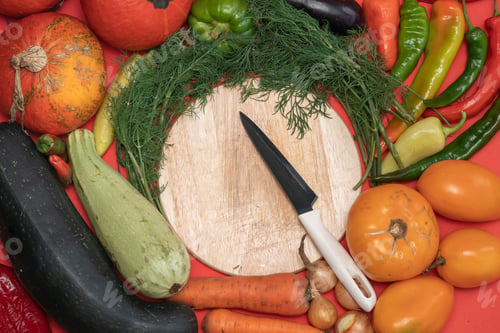 Preview: Vegetables are laid out around empty place. Empty space for text. Vegetables on a wooden board.