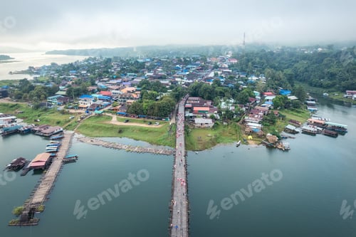Preview: Traditional Mon village in morning foggy and wooden Mon bridge in the dam at Sangkhlaburi