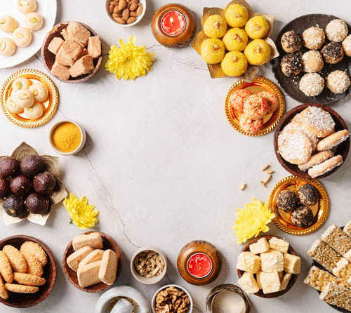Preview: traditional indian sweets on concrete background flat lay