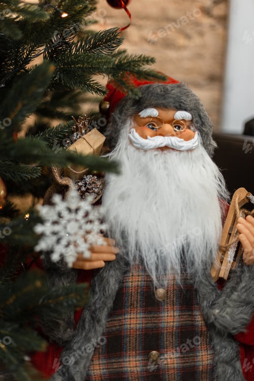 Preview: Vintage toy Santa Claus standing by the Christmas tree