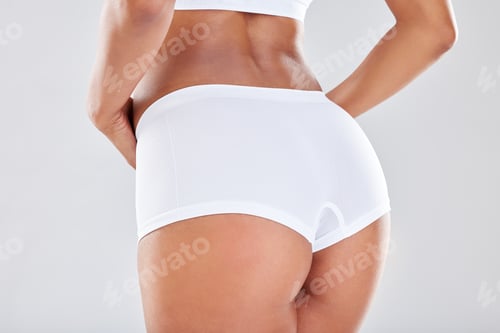 Preview: Woman, ass and underwear with sexy waist in weight loss, diet or healthcare against a grey studio b