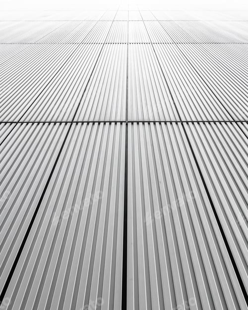 Preview: Vertical shot of a grey facade of a building - great for background or wallpaper