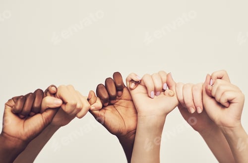 Preview: Cropped shot of a group of unrecognizable people holding one anothers thumbs in a single line