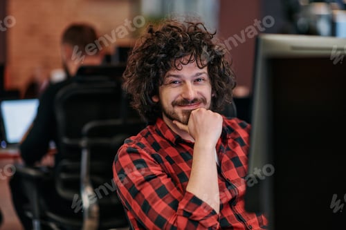 Preview: Focused Programmer With Afro Hairstyle in Plaid Shirt Working on Computer in Office Environment