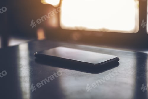 Preview: A single black mobile phone on the table