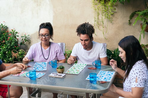 Preview: Family smiling together, while playing at home
