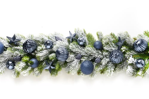 Preview: Christmas frame with blue baubles and stars in row on snowy evergreen branches.