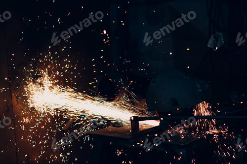 Preview: Metal processing with big angle grinder disk saw. Sparks in metalworking at factory worker