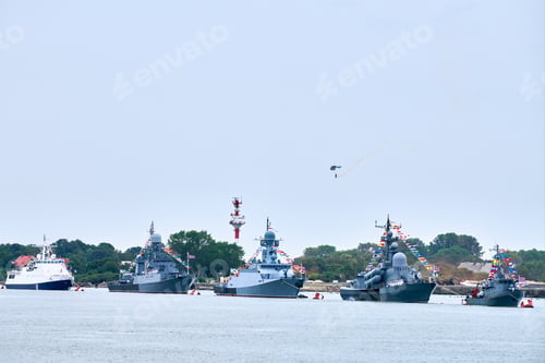 Preview: Airborne forces paratroopers flying Russian flag over naval forces parade warships along coastline