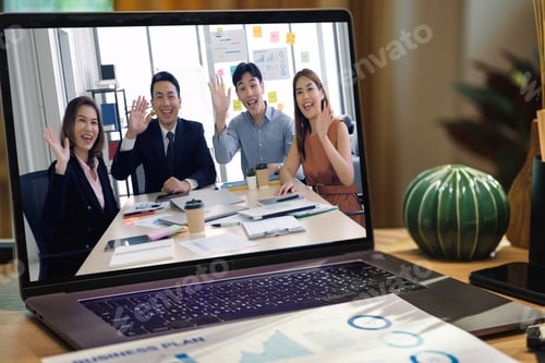 Preview: close up screen groupd of asian colleage video confernece business plan with laptop on table at home