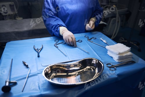 Preview: Close-up of hands arranging surgical tools