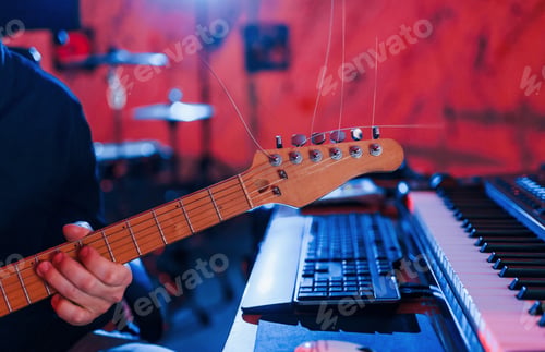 Preview: Guitar player have recording session indoors in the studio