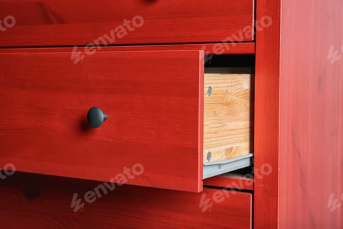 Preview: Red chest of drawers, closeup. Stylish furniture for wardrobe room