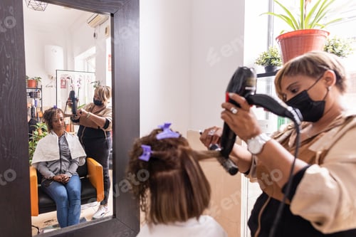 Preview: haircut hairstyle Hispanic professional beauty salon female with coronavirus facemask mixed race