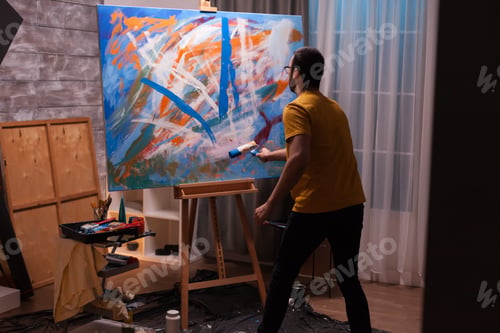 Preview: Man paiting with roller