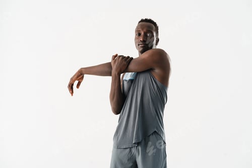 Preview: Young african american sportsman doing exercise while working out