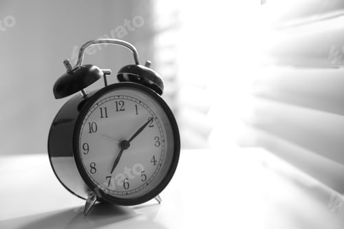 Preview: Alarm clock on windowsill, space for text. Morning time