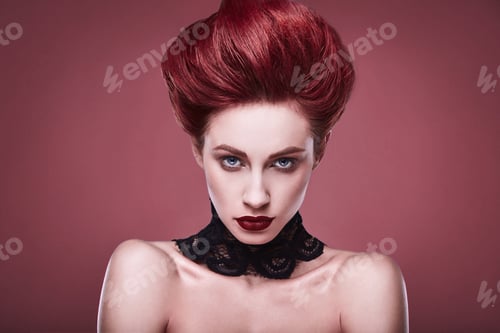 Preview: Beauty Stylish Redhead Woman With Hairstyle And Wearing Necklace Jewelry In Studio On Red Background