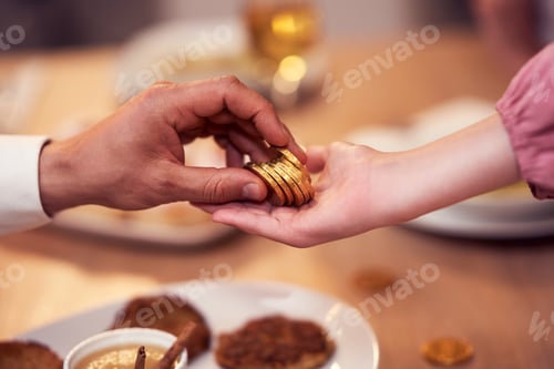 Preview: Hanukkah dinner. Family gathered around the table with traditional dishes