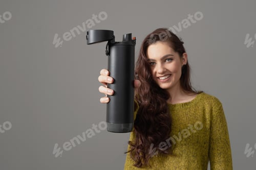 Preview: woman holding eco reusable smart thermo water bottle with drink reminder, healthy lifestyle concept