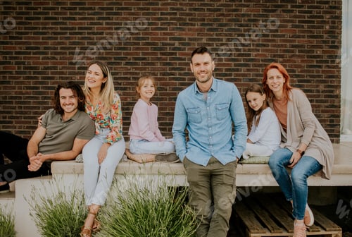 Preview: Group of young people and kids having good time in the house backyard