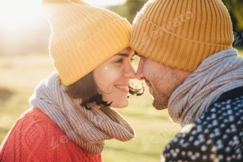 Preview: Outdoor portrait of lovely female and her boyfriend, look at each other`s eyes