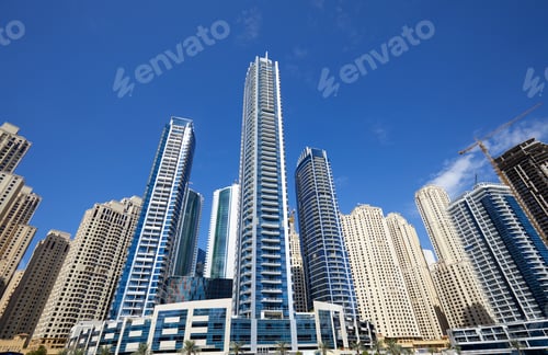 Preview: Dubai Marina new and under construction skyscrapers in a sunny day, clear blue sky in Dubai