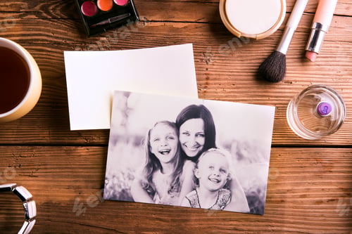 Preview: Mothers day composition. Family photo and beauty products.