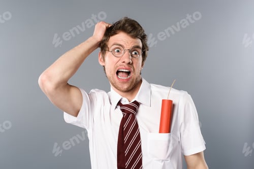 Preview: scared businessman in glasses screaming with dynamite in pocket