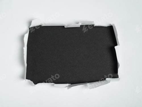 Preview: Torn hole in white paper revealing black background, space for text