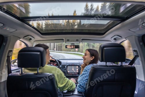 Preview: Man and woman traveling in car, sitting in car driving to travel destination.