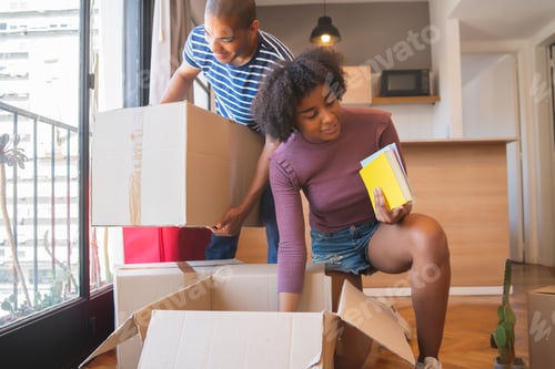 Preview: Latin couple unpacking at their new house.