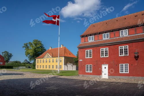 Preview: Kastellet fortress buildings and the Commander House with the flag of Denmark - Copenhagen, Denmark