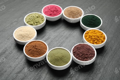 Preview: Different superfood powders in bowls on black table