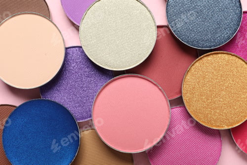 Preview: Different beautiful eye shadows on pink background, flat lay