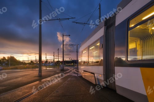 Preview: Tram stop. Public transport and sky during sunset. Transportation.