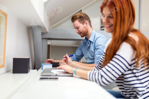 Preview: Colleagues working studying in white office