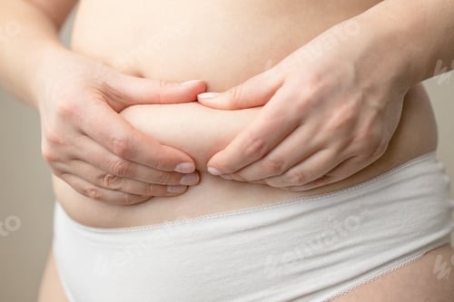 Preview: fat woman using her hands to squeeze out excess fat that